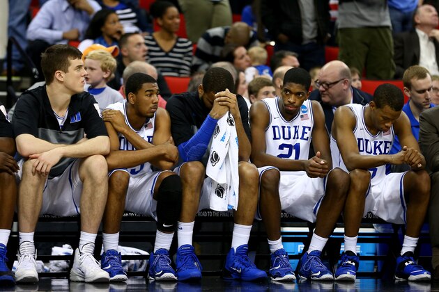 RALEIGH, NC - MARCH 21:  Amile Jefferson #21 and the Duke Blue Devils bench late in the second half against the Mercer Bears before losing 78-71 in the second round of the 2014 NCAA Men's Basketball Tournament at PNC Arena on March 21, 2014 in Raleigh, North Carolina.  (Photo by Streeter Lecka/Getty Images)