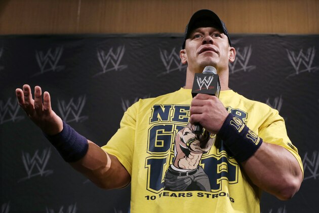 WWE wrestling super star John Cena answers a question during a news conference Sunday, April 7, 2013, in East Rutherford, N.J., ahead of Sunday's WWE Wrestlemania 29. (AP Photo/Mel Evans)