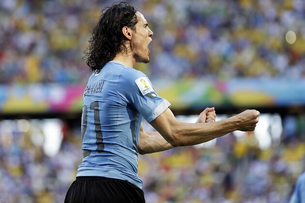 Uruguay's Edinson Cavani celebrates after kicking a penalty shot to score his side's first goal during the group D World Cup soccer match between Uruguay and Costa Rica at the Arena Castelao in Fortaleza, Brazil, Saturday, June 14, 2014.  (AP Photo/Natacha Pisarenko)