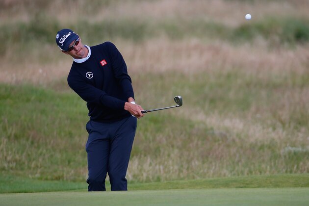 HOYLAKE, ENGLAND - JULY 14:  Adam Scott of Australia plays an iron shot during a practice round prior to the start of the 143rd Open Championship at Royal Liverpool on July 14, 2014 in Hoylake, England.  (Photo by Tom Pennington/Getty Images)