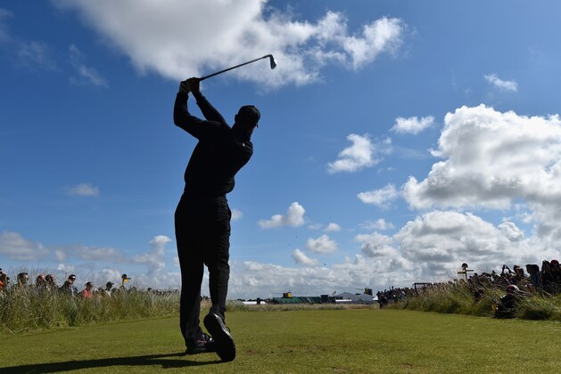 HOYLAKE, ENGLAND - JULY 15:  Tiger Woods of the United States tees off during a practice round prior to the start of The 143rd Open Championship at Royal Liverpool on July 15, 2014 in Hoylake, England.  (Photo by Stuart Franklin/Getty Images)