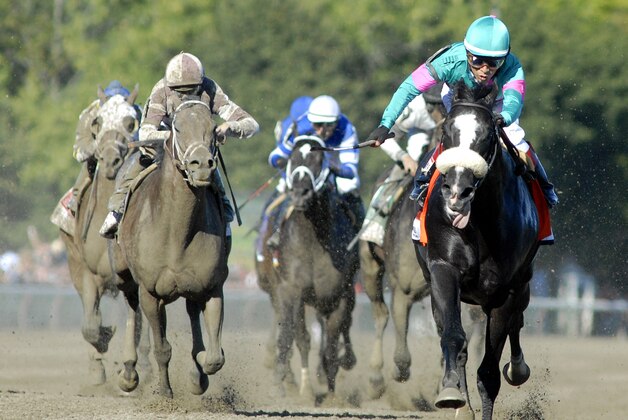 Mentor Cane with Jockey Edgar Prado, right, is chased down by Capo Baston with Jockey Irad Ortiz Jr. to a second place finish in the Kings Bishop Stakes horse race at Saratoga Race Course in Saratoga Springs, N.Y., Saturday, Aug. 24, 2013. (AP Photo /Hans Pennink)
