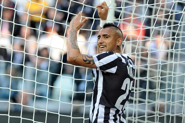 Juventus' Arturo Vidal smiles during a Serie A soccer match between Juventus and Fiorentina at the Juventus stadium, in Turin, Italy, Sunday, March 9, 2014. (AP Photo/Massimo Pinca)