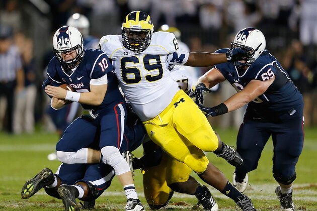 EAST HARTFORD, CT - SEPTEMBER 21: Willie Henry #69 of the Michigan Wolverines sacks Chandler Whitmer #10 of the Connecticut Huskies in the 4th against the Connecticut Huskies at Rentschler Field on September 21, 2013 in East Hartford, Connecticut.   (Photo by Jim Rogash/Getty Images)