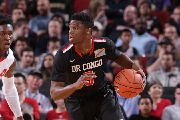 PORTLAND, OR - APRIL 12:  Emmanuel Mudiay #5 of the World Team dribbles the ball during the game against Team USA on April 12, 2014 at the Moda Center Arena in Portland, Oregon. NOTE TO USER: User expressly acknowledges and agrees that, by downloading and or using this photograph, user is consenting to the terms and conditions of the Getty Images License Agreement. Mandatory Copyright Notice: Copyright 2014 NBAE (Photo by Sam Forencich/NBAE via Getty Images)