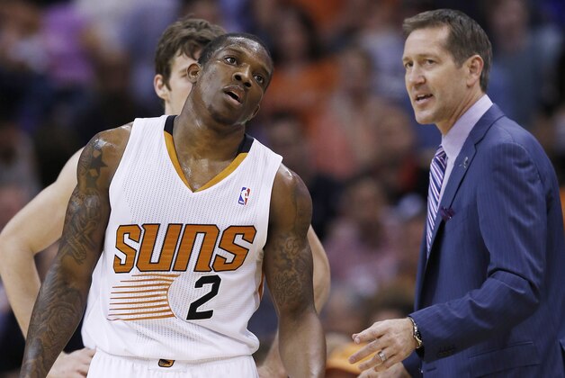 Phoenix Suns' Eric Bledsoe (2) and Goran Dragic, back, of Slovenia, talk with head coach Jeff Hornacek, right, during the second half of an NBA basketball game against the Cleveland Cavaliers, Wednesday, March 12, 2014, in Phoenix.  The Cavaliers defeated the Suns 110-101. (AP Photo/Ross D. Franklin)