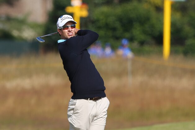 Adam Scott of Australia plays a shot on the 5th hole during a practice round ahead of the British Open Golf championship at the Royal Liverpool golf club, Hoylake, England, Tuesday July 15, 2014. The British Open starts on Thursday July 17. (AP Photo/Jon Super)