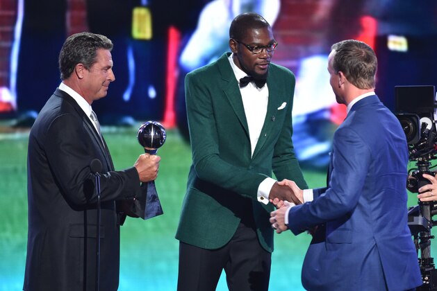 Dan Marino and Kevin Durant present the award for best record breaker to Peyton Manning at the ESPY Awards at the Nokia Theatre on Wednesday, July 16, 2014, in Los Angeles. (Photo by John Shearer/Invision/AP) Dan Marino and Kevin Durant present the award for best record breaker to Peyton Manning at the ESPY Awards at the Nokia Theatre on Wednesday, July 16, 2014, in Los Angeles. (Photo by John Shearer/Invision/AP)