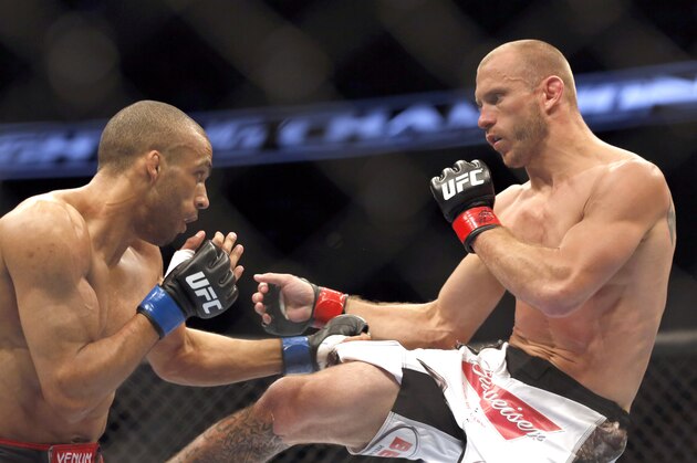 Donald Cerrone, right, and Edson Barboza, of Brazil, fight in a mixed martial arts event on Saturday, April 19, 2014, at UFC Fight Night in Orlando Fla. Cerrone won by tap out. (AP Photo/Reinhold Matay)