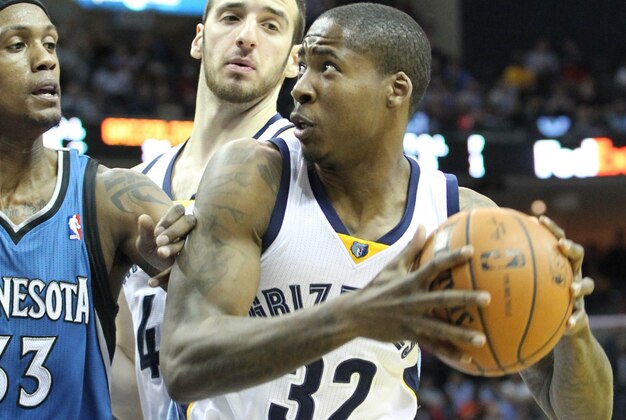 Mar 24, 2014; Memphis, TN, USA; Memphis Grizzlies forward Ed Davis (32) drives against Minnesota Timberwolves forward Dante Cunningham (33) as Grizzlies center Kosta Koufus (41) looks on during the first half at FedExForum. Mandatory Credit: Nelson Chenault-USA TODAY Sports