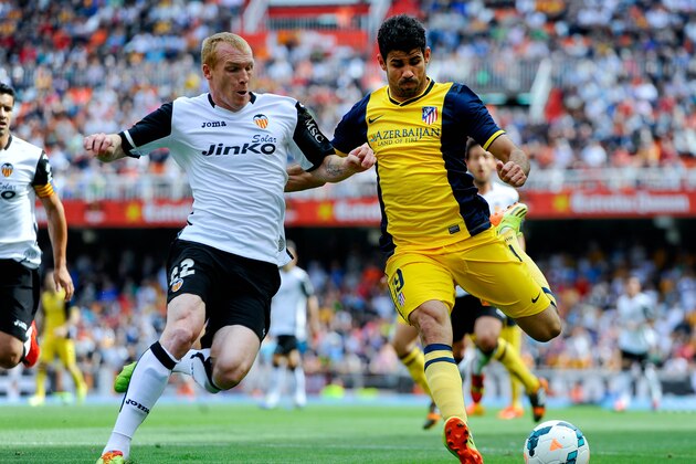VALENCIA, SPAIN - APRIL 27: Diego Costa of Club Atletico de Madrid competes for the ball Jeremy Mathieu of Valencia CF during the La Liga match between Valencia CF and Club Atletico de Madrid at Estadio Mestalla on April 27, 2014 in Valencia, Spain. (Photo by David Ramos/Getty Images) VALENCIA, SPAIN - APRIL 27: Diego Costa of Club Atletico de Madrid competes for the ball Jeremy Mathieu of Valencia CF during the La Liga match between Valencia CF and Club Atletico de Madrid at Estadio Mestalla on April 27, 2014 in Valencia, Spain. (Photo by David Ramos/Getty Images)