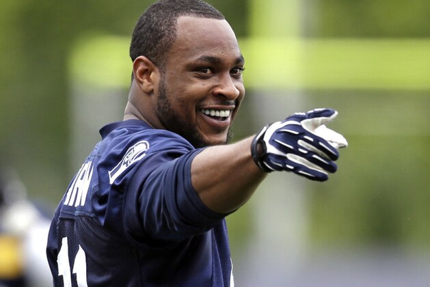 Seattle Seahawks' Percy Harvin smiles during an NFL organized team activity football practice Thursday, June 12, 2014, in Renton, Wash. (AP Photo/Elaine Thompson)