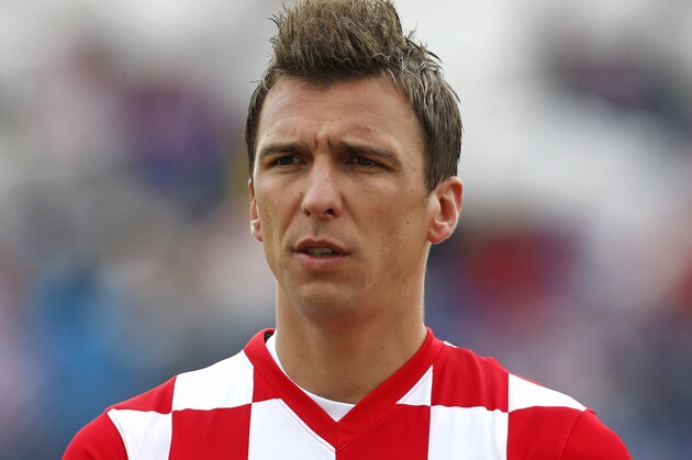 Croatia's Mario Mandzukic listens to the national anthem ahead of the international soccer friendly match between Croatia and Mali, in Osijek, Croatia, Saturday, May 31, 2014. (AP Photo/Darko Bandic)