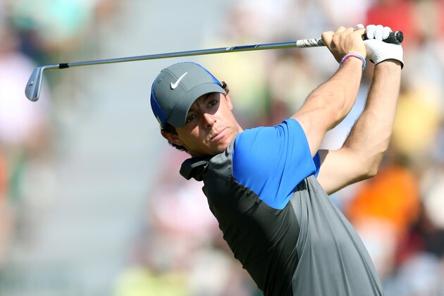 Rory McIlroy of Northern Ireland plays a shot off the 4th tee during the first day of the British Open Golf championship at the Royal Liverpool golf club, Hoylake, England, Thursday July 17, 2014. (AP Photo/Scott Heppell)