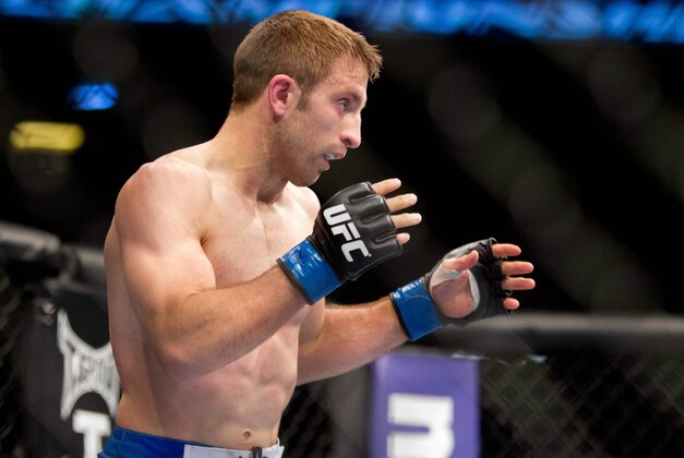 Oct 5, 2012; Minneapolis, MN, USA; Phil Harris gets position to bout Darren Uyenoyama (not pictured) at the UFC on FX 5 at the Target Center. Mandatory Credit: Bruce Kluckhohn-USA TODAY Sports