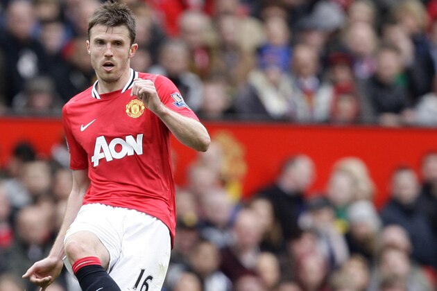 Manchester United's Michael Carrick during his team's  English Premier League soccer match against Queens Park Rangers at Old Trafford Stadium, Manchester, England, Sunday, April 8, 2012. (AP Photo/Jon Super)