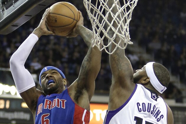 Detroit Pistons forward Josh Smith, left, goes to the basket against Sacramento Kings center DeMarcus Cousins during the first quarter of an NBA basketball game in Sacramento, Calif., Friday, Nov. 15, 2013.The Pistons won 97-90 (AP Photo/Rich Pedroncelli)