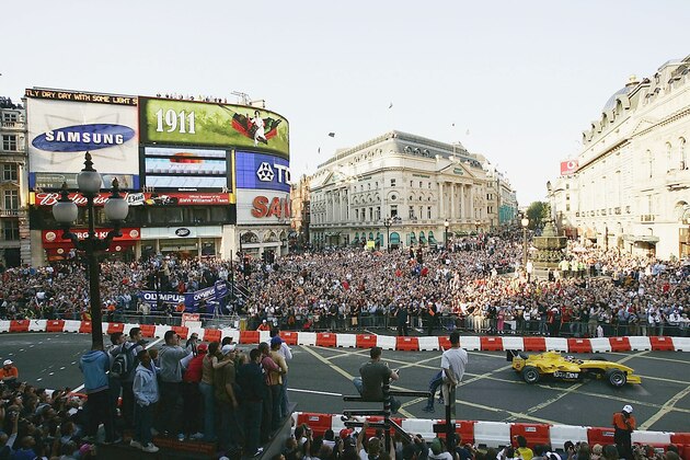 LONDON - JULY 6:  Nigel Mansell of Great Britain drives the Jordan Formula One car through the streets of London during the Formula One Regent Street Parade, in Regent Street on July 6, 2004 in London, England. (Photo by Mark Thompson/Getty Images)
