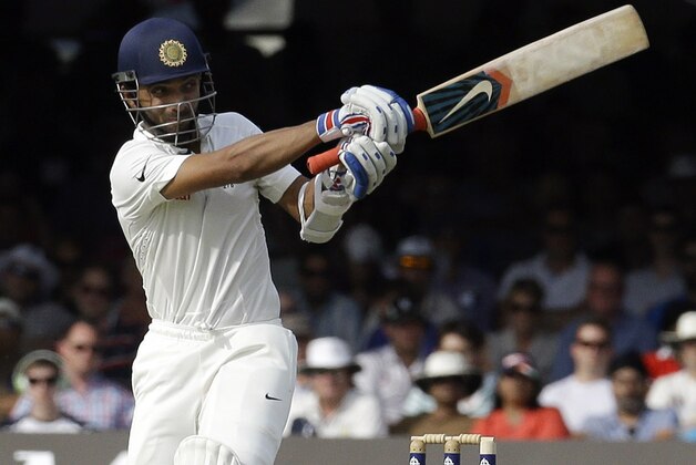 India's Ajinkya Rahane plays a shot off the bowling of England's Liam Plunkett during the first day of the second test match between England and India at Lord's cricket ground in London, Thursday, July 17, 2014. (AP Photo/Kirsty Wigglesworth)