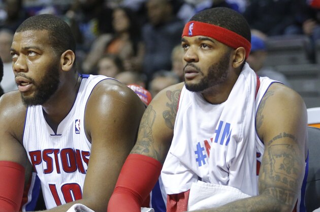 Detroit Pistons guard Brandon Jennings, from left, center Greg Monroe and forward Josh Smith watch their game against the Brooklyn Nets from the bench during the second half of an NBA basketball game Friday, Feb. 7, 2014, in Auburn Hills, Mich. (AP Photo/Duane Burleson)