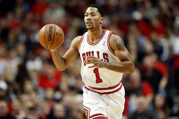 Chicago Bulls guard Derrick Rose moves the ball against Utah Jazz during the first half of an NBA basketball game in Chicago, Friday, Nov. 8, 2013. Bulls won 97-73. (AP Photo/Kamil Krzaczynski)