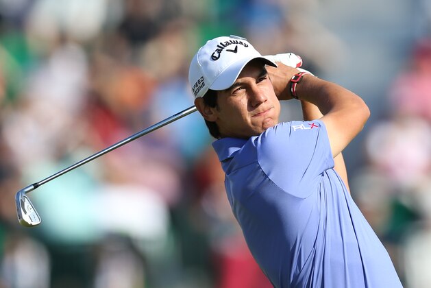 Matteo Manassero of Italy plays a shot off the 4th tee during the first day of the British Open Golf championship at the Royal Liverpool golf club, Hoylake, England, Thursday July 17, 2014. (AP Photo/Scott Heppell)