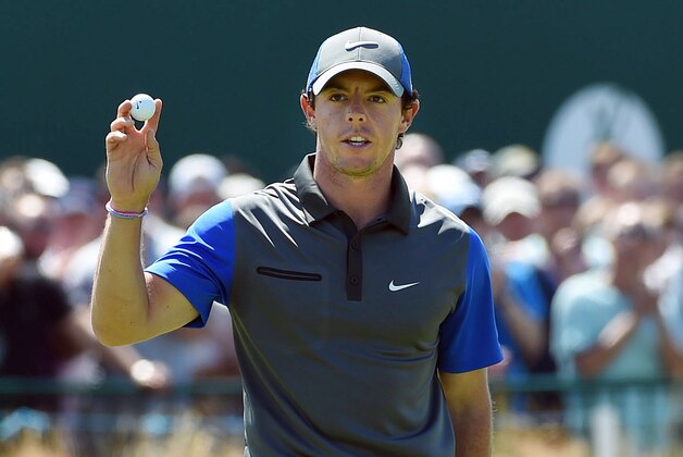 Jul 17, 2014; Wirral, Merseyside, GBR;    Rory McIlroy walks off the 18th green during after finishing the first round of The 143rd Open Championship at the Royal Liverpool Golf Club.  Mandatory Credit: Ian Rutherford-USA TODAY Sports