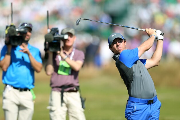 Rory McIlroy of Northern Ireland plays a shot on the 4th fairway during the first day of the British Open Golf championship at the Royal Liverpool golf club, Hoylake, England, Thursday July 17, 2014. (AP Photo/Scott Heppell)