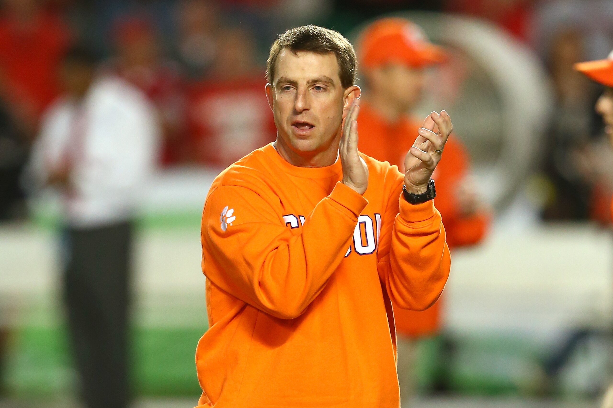 MIAMI GARDENS, FL - JANUARY 03:  Head coach Dabo Swinney of the Clemson Tigers looks on during warm ups prior to the Discover Orange Bowl against the Ohio State Buckeyes at Sun Life Stadium on January 3, 2014 in Miami Gardens, Florida.  (Photo by Streeter Lecka/Getty Images)
