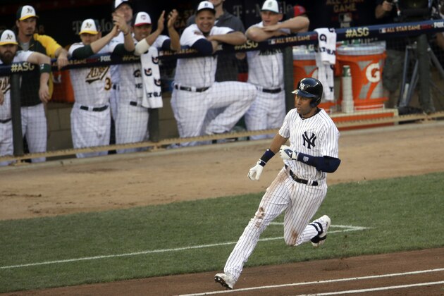 Shortstop Derek Jeter, of the New York Yankees, doubles during the first inning of the MLB All-Star baseball game, Tuesday, July 15, 2014, in Minneapolis. (AP Photo/Paul Sancya)
