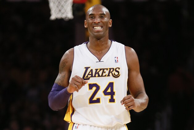 Los Angeles Lakers' Kobe Bryant winces against the Toronto Raptors during the first half of an NBA basketball game in Los Angeles, Sunday, Dec. 8, 2013. It was Bryant's first game back after a torn left Achilles tendon injury on April 12th and the Raptors won 106-94. (AP Photo/Danny Moloshok)