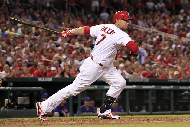 St. Louis Cardinals' Matt Holliday watches his RBI double during the fifth inning of a baseball game against the New York Mets Tuesday, June 17, 2014, in St. Louis. (AP Photo/Jeff Roberson)