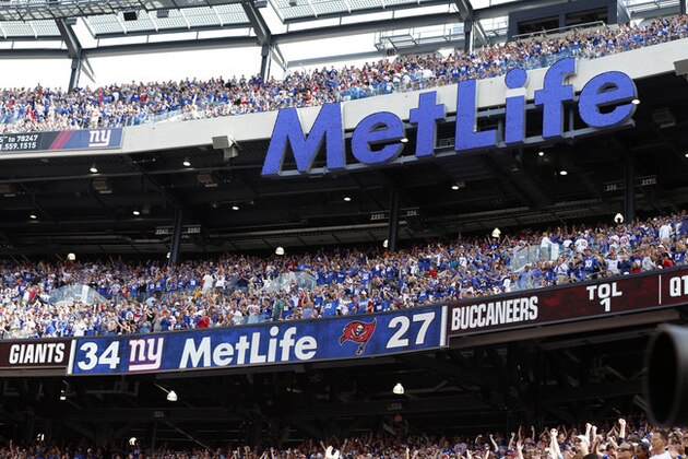 The scoreboard is seen after the New York Giants took a lead over the Tampa Bay Buccaneers during the second half of an NFL football game Sunday, Sept. 16, 2012, in East Rutherford, N.J. The Giants won the game 41-34. (AP Photo/Julio Cortez)