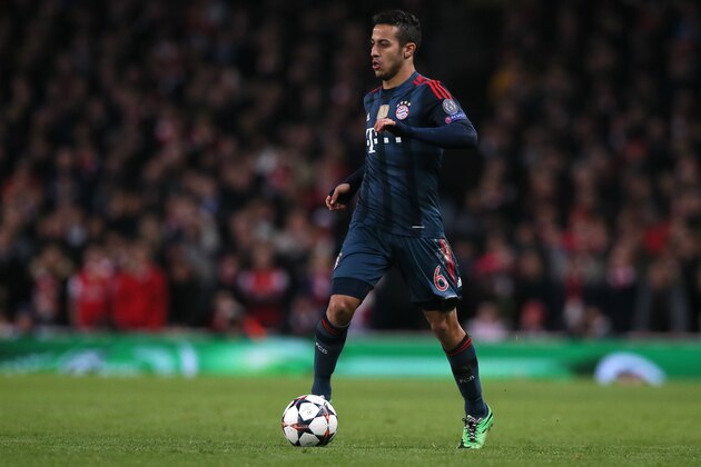 Bayern's Thiago Alcantara takes the ball forward during a Champions League, round of 16, first leg soccer match between Arsenal and Bayern Munich at the Emirates stadium in London, Wednesday, Feb. 19, 2014 .(AP Photo/Alastair Grant)