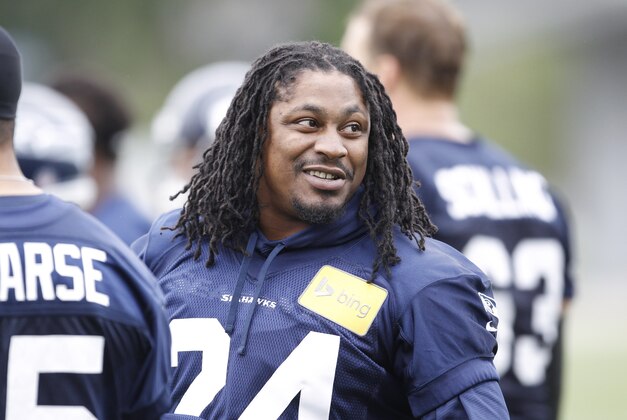 Jun 17, 2014; Renton, WA, USA; Seattle Seahawks running back Marshawn Lynch (24) talks with a teammate during minicamp at the Virginia Mason Athletic Center. Mandatory Credit: Joe Nicholson-USA TODAY Sports