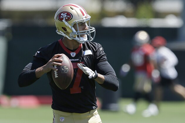 San Francisco 49ers quarterback Colin Kaepernick passes during NFL football minicamp in Santa Clara, Calif., Thursday, June 19, 2014. (AP Photo/Jeff Chiu) San Francisco 49ers quarterback Colin Kaepernick passes during NFL football minicamp in Santa Clara, Calif., Thursday, June 19, 2014. (AP Photo/Jeff Chiu)