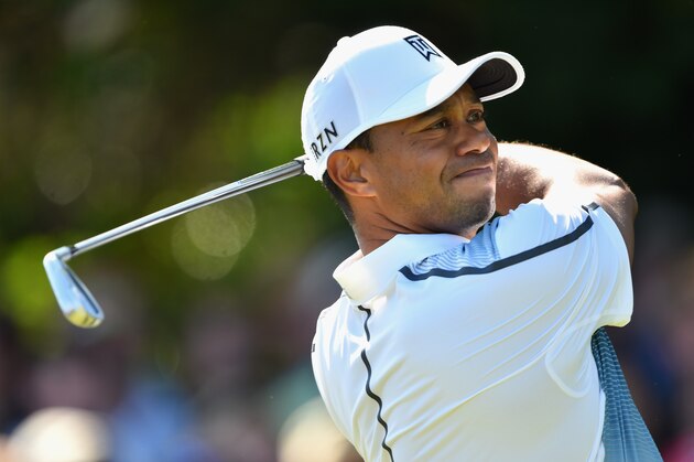 HOYLAKE, ENGLAND - JULY 17:  Tiger Woods of the United States tees off on the 4th hole during the first round of The 143rd Open Championship at Royal Liverpool on July 17, 2014 in Hoylake, England.  (Photo by Stuart Franklin/Getty Images)