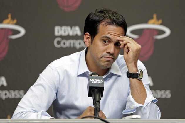 Miami Heat head coach Erik Spoelstra pauses as he talks to reporters during a news conference in Miami, Tuesday, June 17, 2014. The Miami Heat held their season-wrapup team meeting on Tuesday afternoon and one of the biggest questions is about the future of the roster. LeBron James could become a free agent in a couple of weeks and the four-time MVP says he still has not thought about his plans.(AP Photo/Alan Diaz)