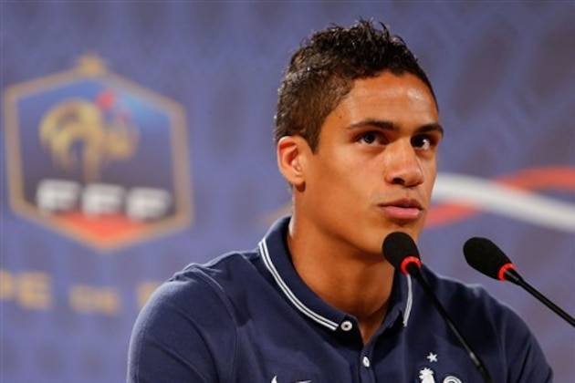 CORRECTS DATE - France's defender Raphael Varane answers journalists' questions during a press conference at the Teatro Pedro II, in Ribeirao Preto, Brazil, Saturday, June 21, 2014. Having captured people's attention at the soccer World Cup with some scintillating attacking football, France's players are now in unknown territory after raising expectations back home, having routed Switzerland and Honduras. (AP Photo/David Vincent)