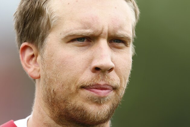 Philadelphia Eagles quarterback Nick Foles walks off the field after an NFL football organized team activity Thursday, May 29, 2014, in Philadelphia. (AP Photo/Matt Rourke)