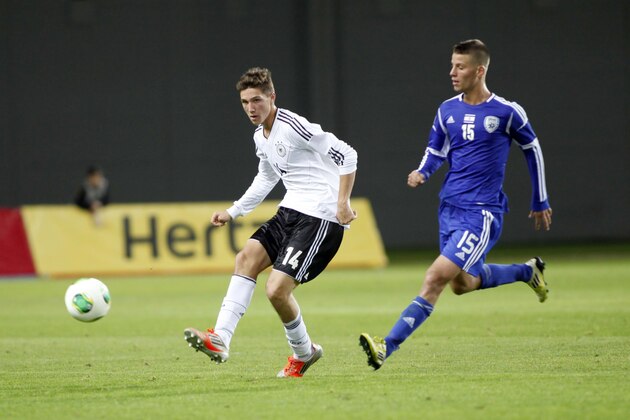 NETANYA, ISRAEL- DECEMBER 11: Niklas Stark of Germany kicks the ball while being defended by Eden Shamir of Israel during the Under 18 International Friendly match between Israel and Germany on December 11 2012 in Netanya , Israel.  (Photo by Lior Mizrahi/Bongarts/Getty Images)