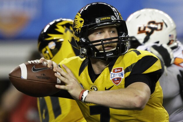 Missouri quarterback Maty Mauk (7) rolls back to pass against Oklahoma State during the second half of the Cotton Bowl NCAA college football game, Friday, Jan. 3, 2014, in Arlington, Texas.  (AP Photo/Tim Sharp)