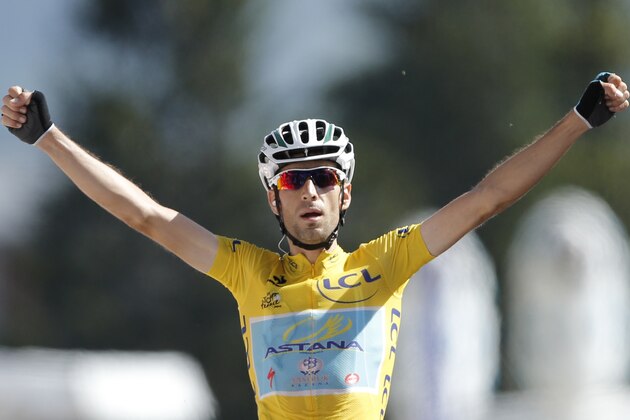 Italy's Vincenzo Nibali crosses the finish line to win the thirteenth stage of the Tour de France cycling race over 197.5 kilometers (122.7 miles) with start in Saint-Etienne and finish in Chamrousse, France, Friday, July 18, 2014. (AP Photo/Peter Dejong) Italy's Vincenzo Nibali crosses the finish line to win the thirteenth stage of the Tour de France cycling race over 197.5 kilometers (122.7 miles) with start in Saint-Etienne and finish in Chamrousse, France, Friday, July 18, 2014. (AP Photo/Peter Dejong)