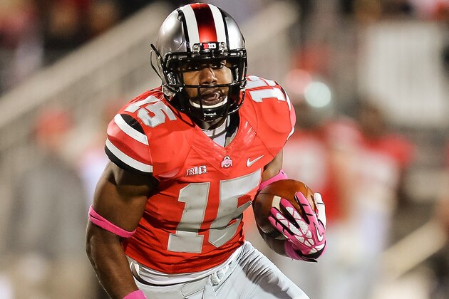 COLUMBUS, OH - OCTOBER 26:  Ezekiel Elliott #15 of the Ohio State Buckeyes runs with the ball against the Penn State Nittany Lions at Ohio Stadium on October 26, 2013 in Columbus, Ohio.  (Photo by Jamie Sabau/Getty Images)