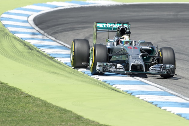 Mercedes Formula One driver Lewis Hamilton of Great Britain races during the free practice session at the German Formula One Grand Prix in Hockenheim, Germany, Friday, July 18, 2014. The German Grand Prix will be held on Sunday, July 20, 2014. (AP Photo/Jens Meyer)
