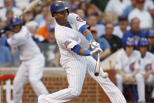 Chicago Cubs' Starlin Castro hits a single against the Atlanta Braves during the sixth inning of a baseball game on Friday, July 11, 2014, in Chicago. (AP Photo/Andrew A. Nelles)