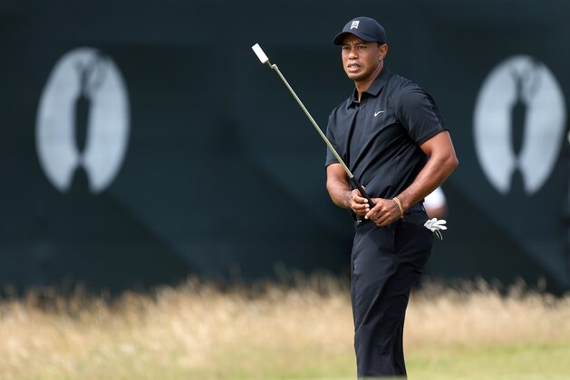 Tiger Woods of the US prepares to putt on the 7th green during the second day of the British Open Golf championship at the Royal Liverpool golf club, Hoylake, England, Friday July 18, 2014. (AP Photo/Peter Morrison) Tiger Woods of the US prepares to putt on the 7th green during the second day of the British Open Golf championship at the Royal Liverpool golf club, Hoylake, England, Friday July 18, 2014. (AP Photo/Peter Morrison)