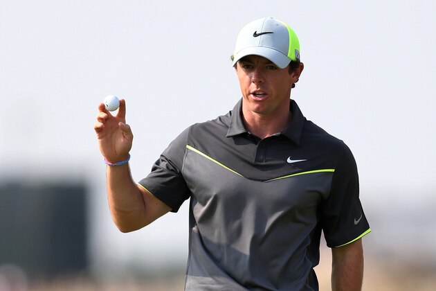 Rory McIlroy of Northern Ireland holds up his ball after playing a birdie on the 8th green during the second day of the British Open Golf championship at the Royal Liverpool golf club, Hoylake, England, Friday July 18, 2014. (AP Photo/Scott Heppell)
