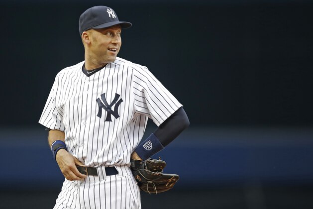 New York Yankees shortstop Derek Jeter looks over his shoulder while waiting for the start of a baseball game against the Oakland Athletics at Yankee Stadium in New York, Wednesday, June 4, 2014.  (AP Photo/Kathy Willens)