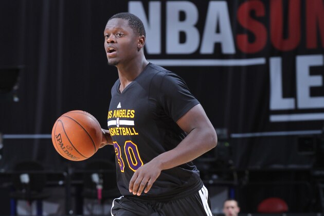 LAS VEGAS, NV - JULY 16: Julius Randle #30 of the Los Angeles Lakers handles the ball against the Philadelphia 76ers on July 16, 2014 at the Thomas & Mack Center in Las Vegas, Nevada. NOTE TO USER: User expressly acknowledges and agrees that, by downloading and or using this photograph, User is consenting to the terms and conditions of the Getty Images License Agreement. Mandatory Copyright Notice: Copyright 2014 NBAE (Photo by Jack Arent/NBAE via Getty Images)
